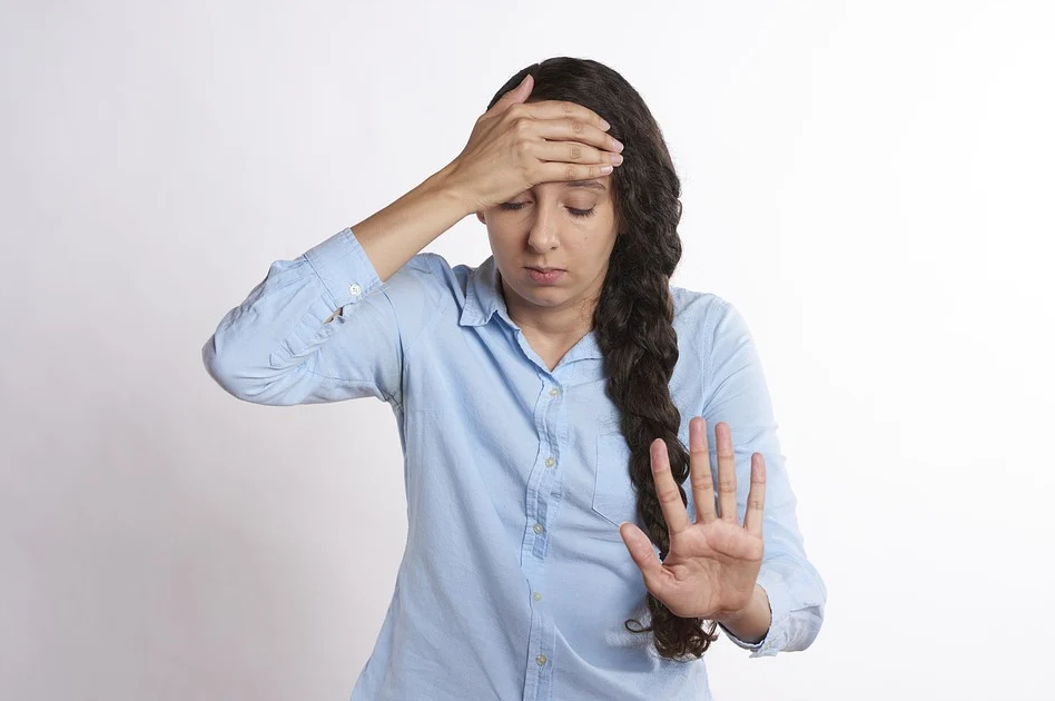 woman touching head